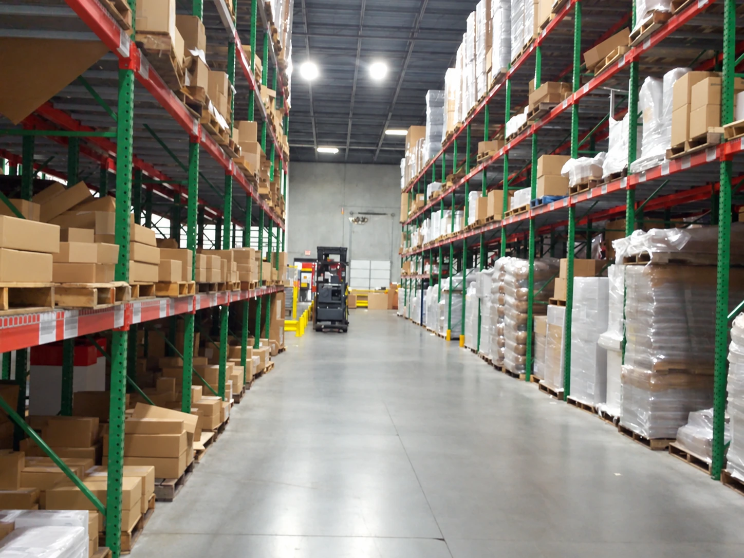 Warehouse aisle with storage racks and palletized goods